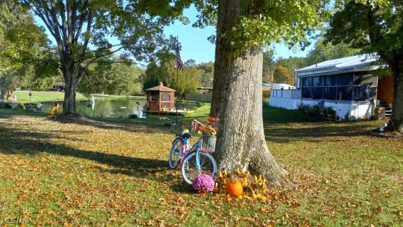 57894 Flamingo Road Senecaville, OH 43780 - Photo 1 of 20 View of yard with a sunroom