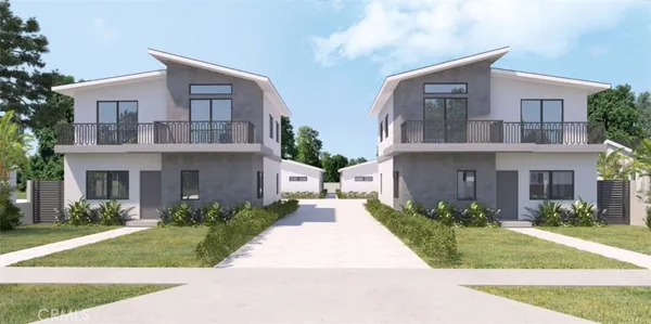 a front view of a house with a garden and plants