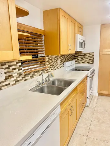 a bathroom with a shower and a glass door