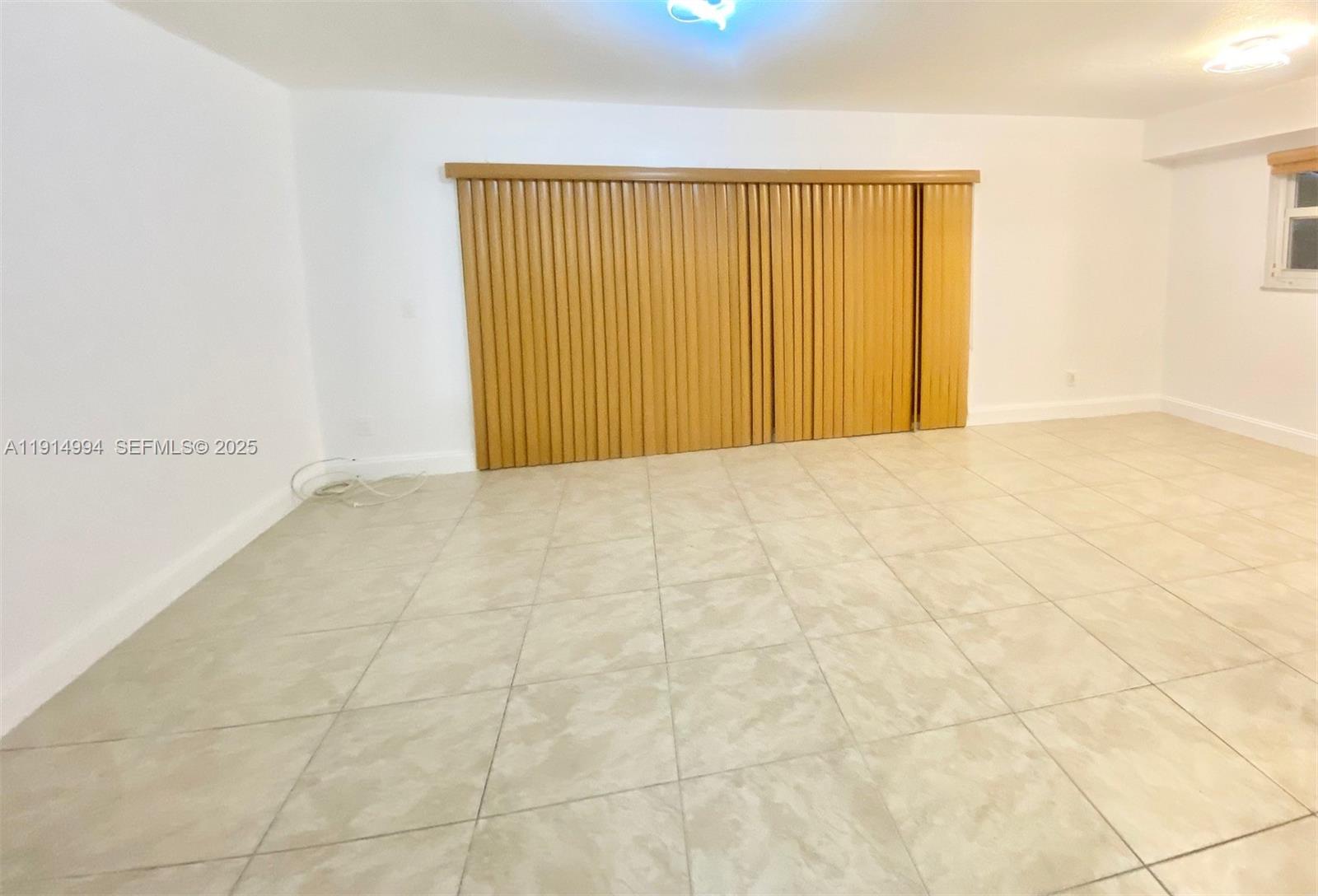 6568 Southwest 41st Place, Unit 151 Davie, FL 33314 - Photo 17 of 65 a view of an empty room with a window