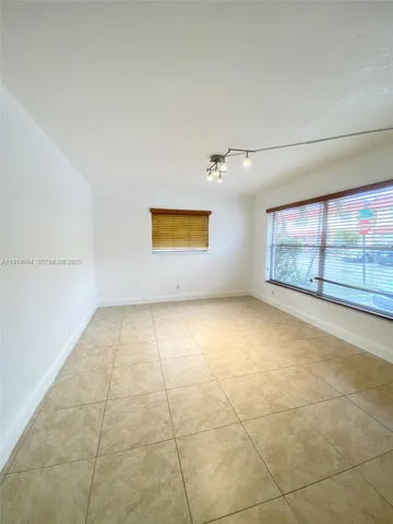 a kitchen with stainless steel appliances granite countertop a stove and a microwave