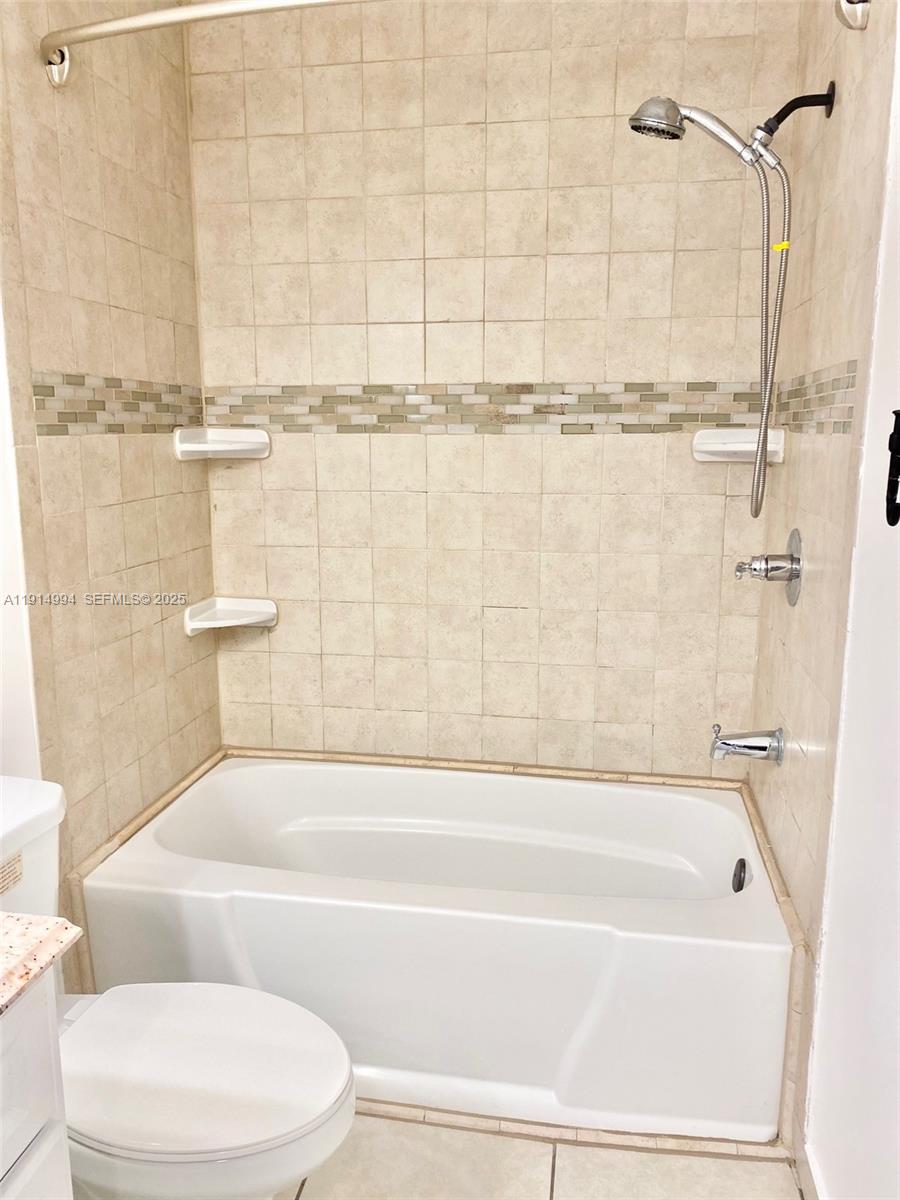 6568 Southwest 41st Place, Unit 151 Davie, FL 33314 - Photo 41 of 65 a bathroom with a bathtub and shower