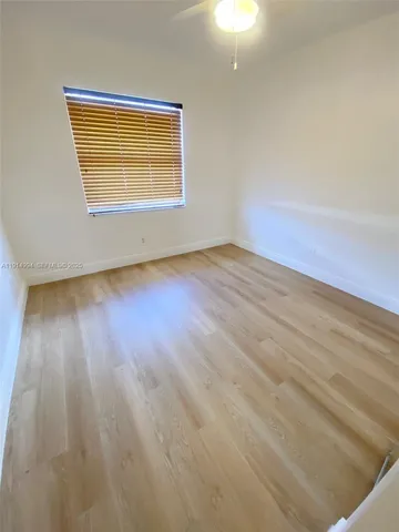 a backyard of a house with lots of green space and a outdoor space