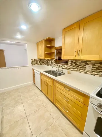 a kitchen with a stove and a microwave