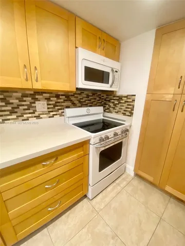 a bathroom with a sink and a washing machine