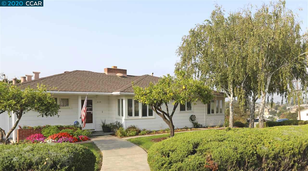 404 Napa Avenue Rodeo, CA 94572 - Photo 1 of 1 a front view of a house with garden