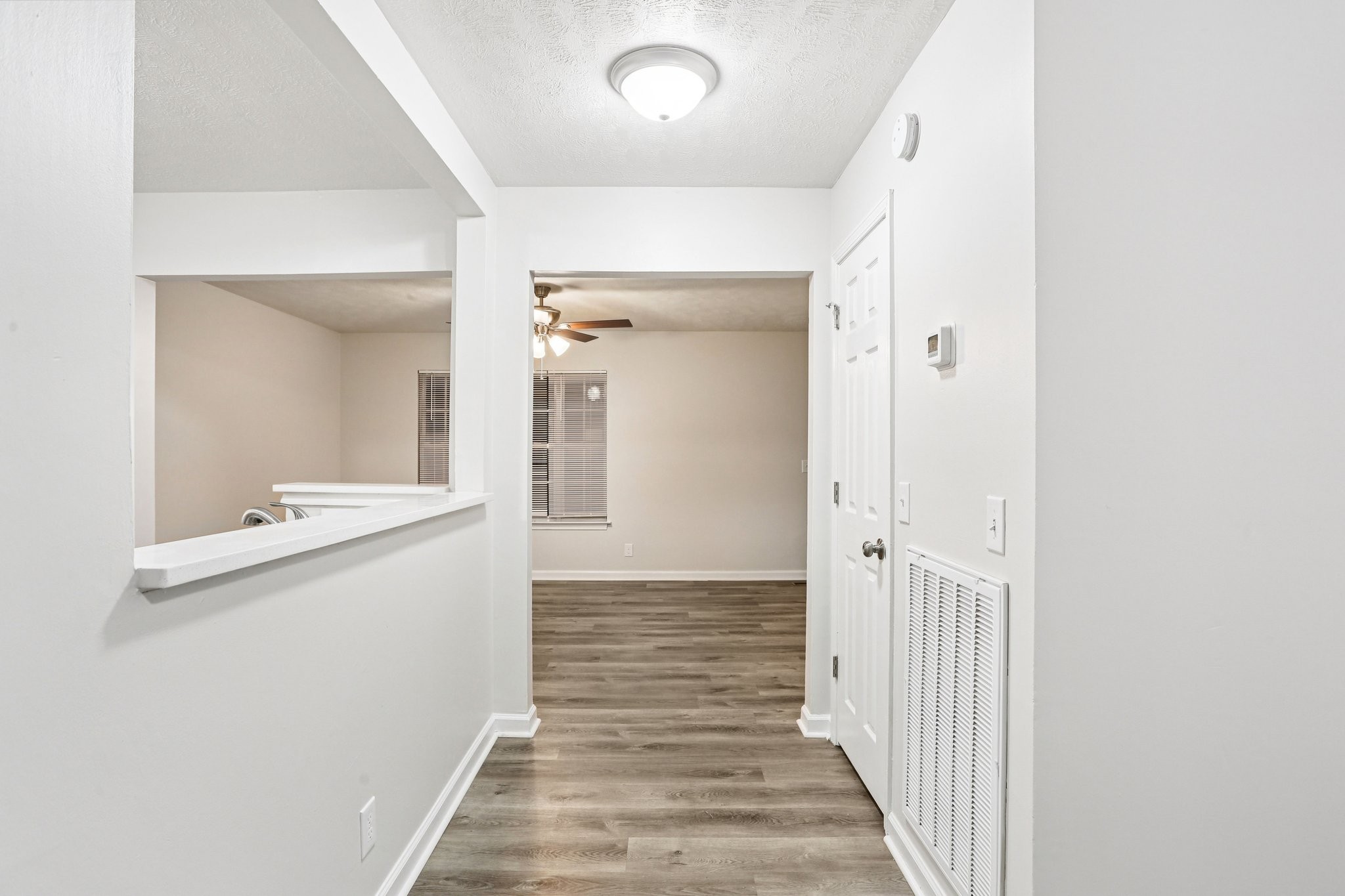 2607 Landrum Court Springfield, TN 37172 - Photo 16 of 30 a view of a hallway with wooden floor and staircase