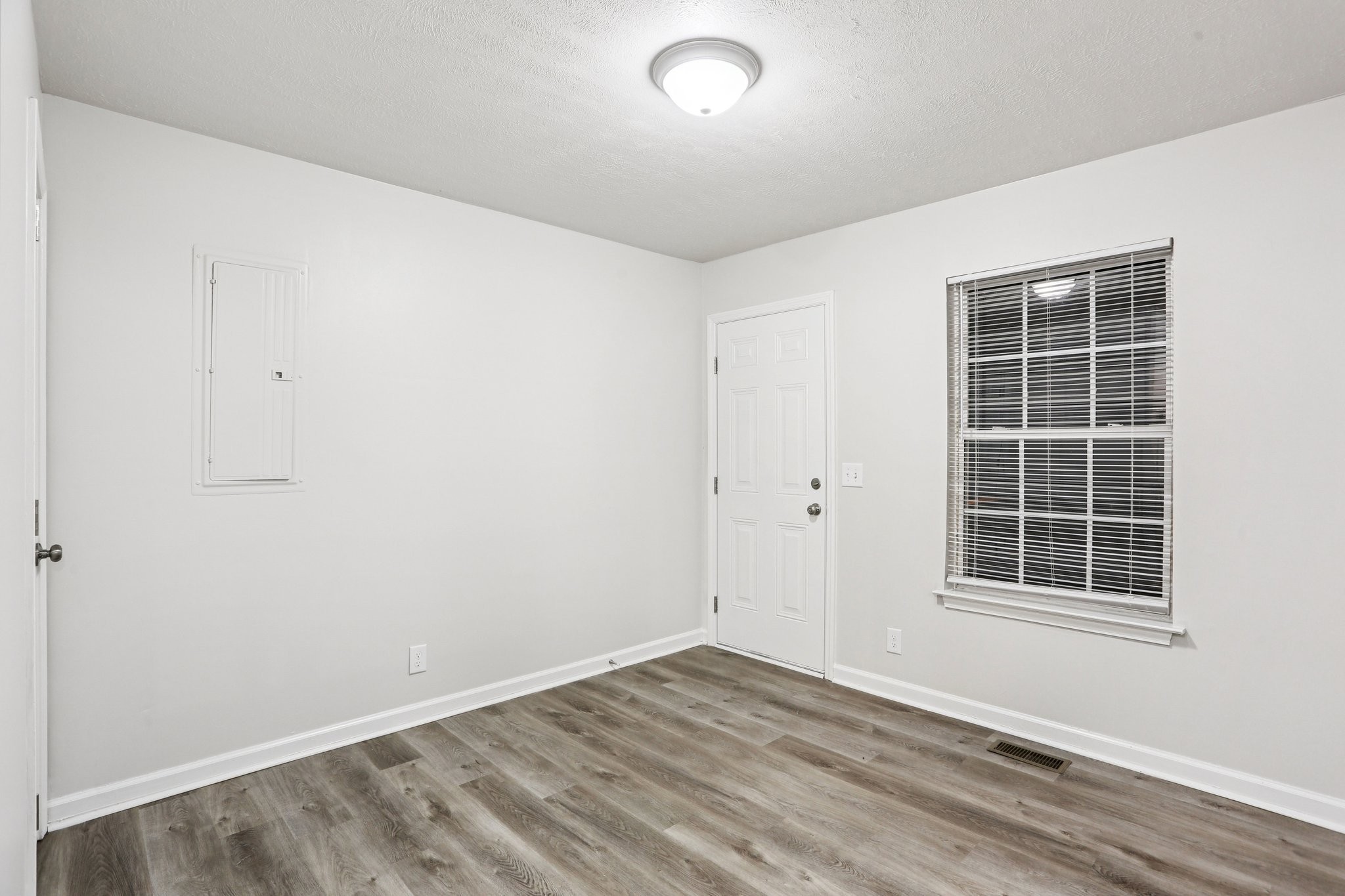 2607 Landrum Court Springfield, TN 37172 - Photo 17 of 30 an empty room with wooden floor and windows