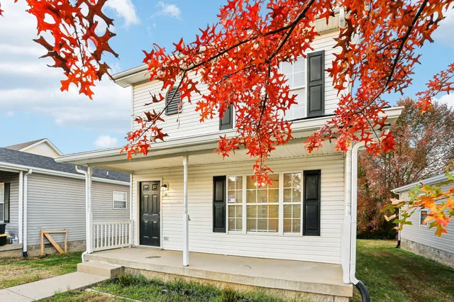 front view of a house with a yard