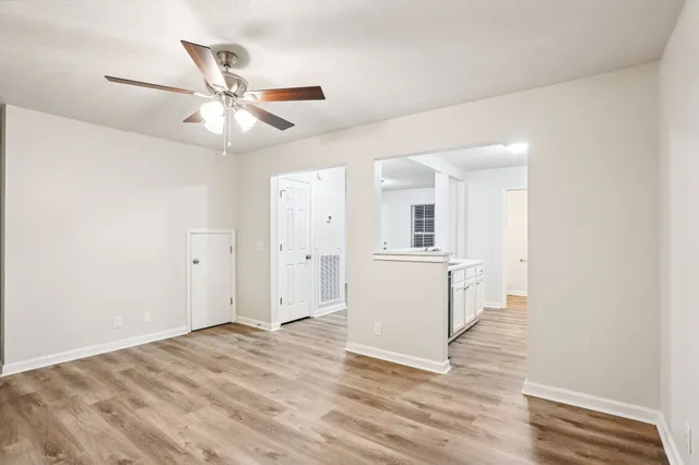 a view of a kitchen and a sink dishwasher with wooden floor