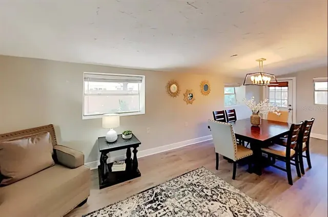 a view of a livingroom with furniture and a window