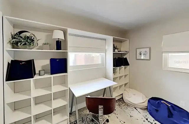 a view of kitchen with a table and chairs