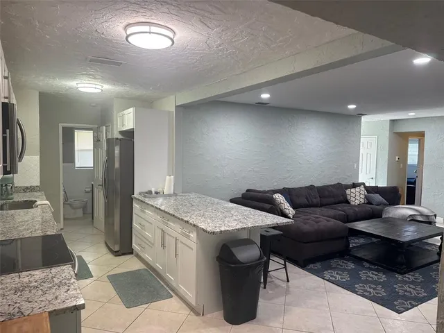 a living room with furniture and a table