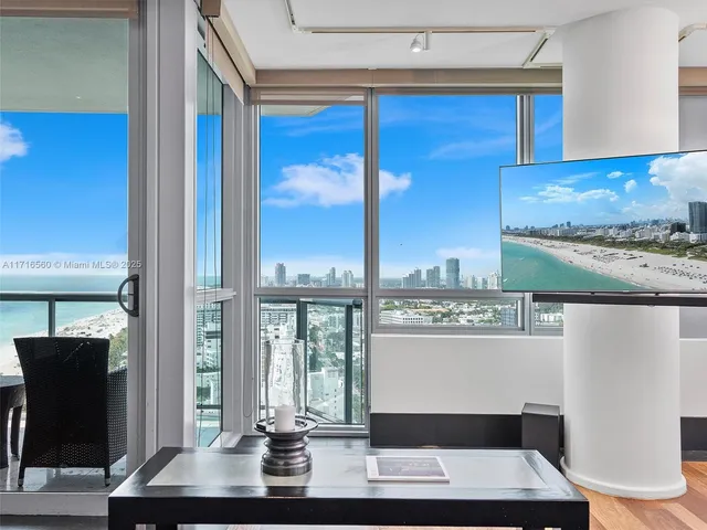 a view of a kitchen with workspace and windows