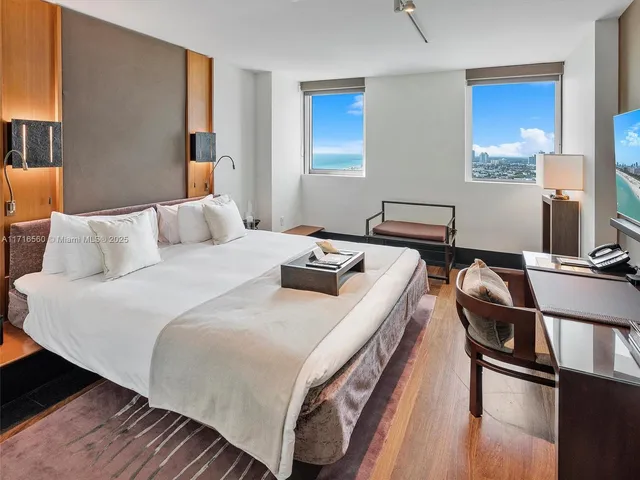 a bedroom with a bed and a view of bathroom