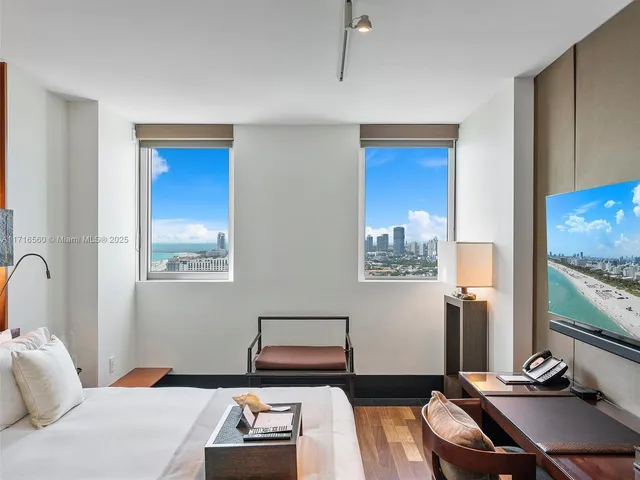 a bedroom with bed and a window