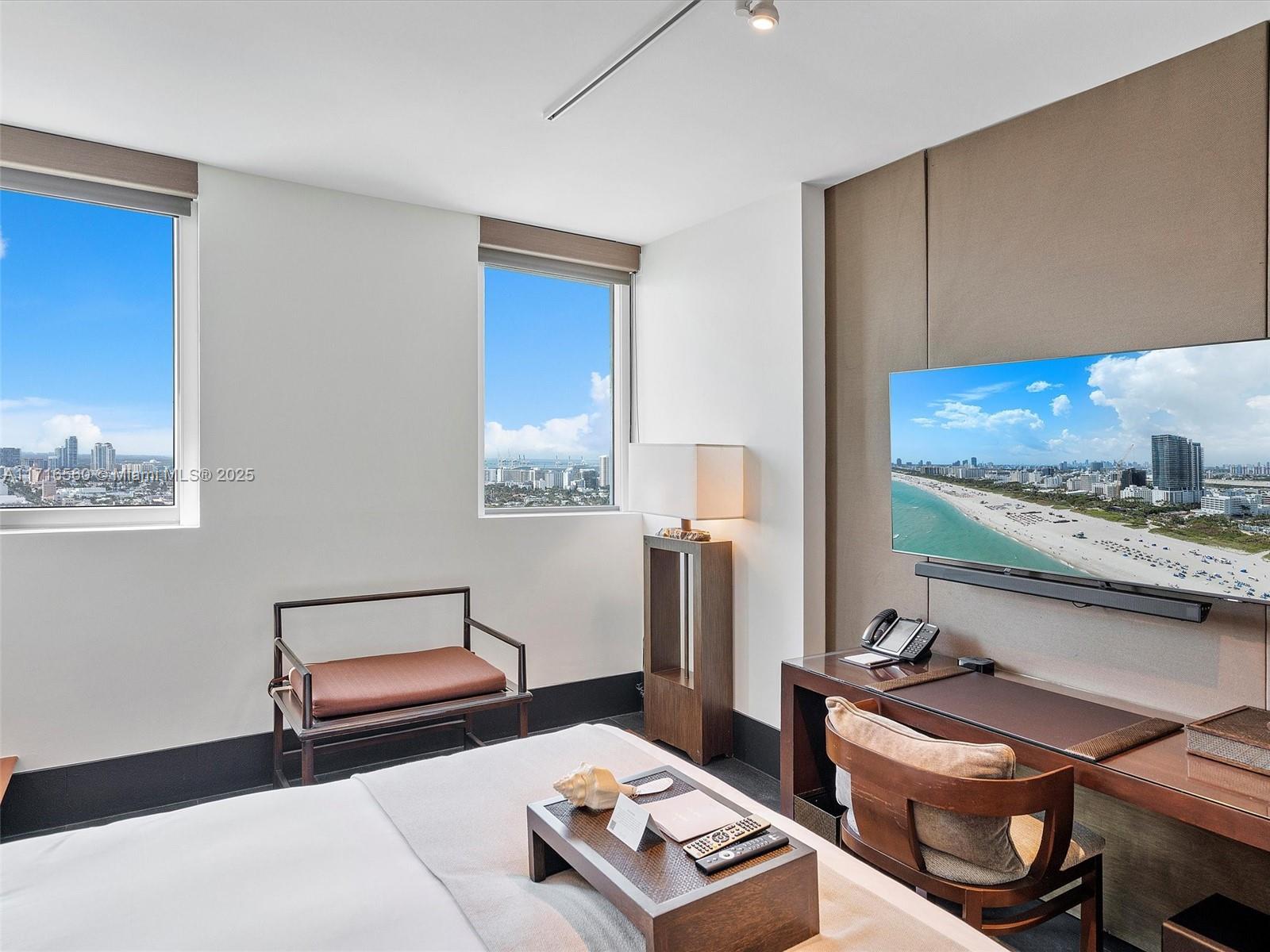 101 20th Street, Unit 3302 Miami Beach, FL 33139 - Photo 26 of 48 a living room with furniture and a wooden floor