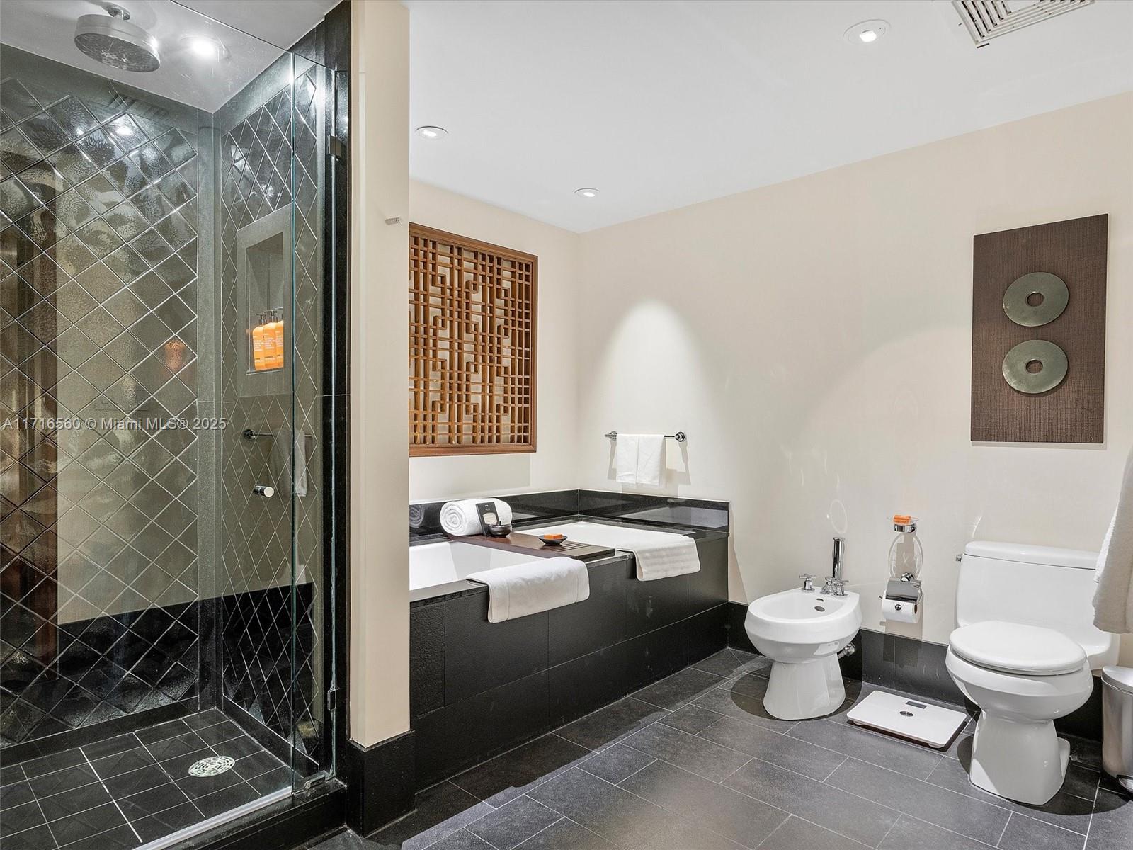 101 20th Street, Unit 3302 Miami Beach, FL 33139 - Photo 29 of 48 a bathroom with a toilet sink and mirror