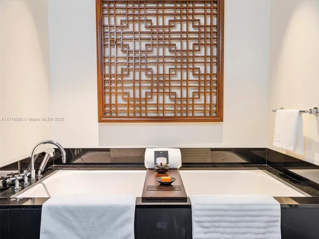 a kitchen with a large counter top space and stainless steel appliances