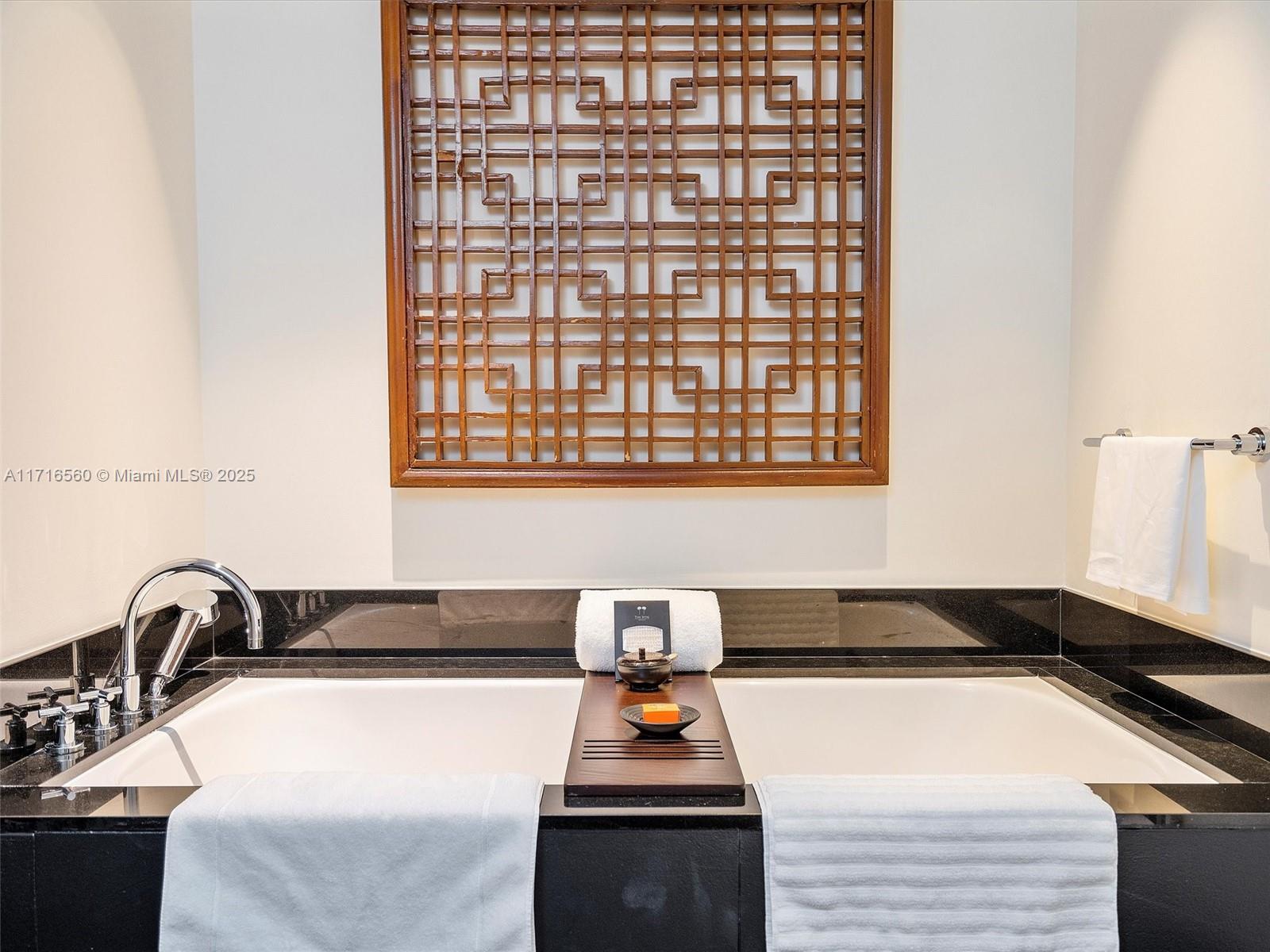 101 20th Street, Unit 3302 Miami Beach, FL 33139 - Photo 30 of 48 a kitchen with a large counter top space and stainless steel appliances