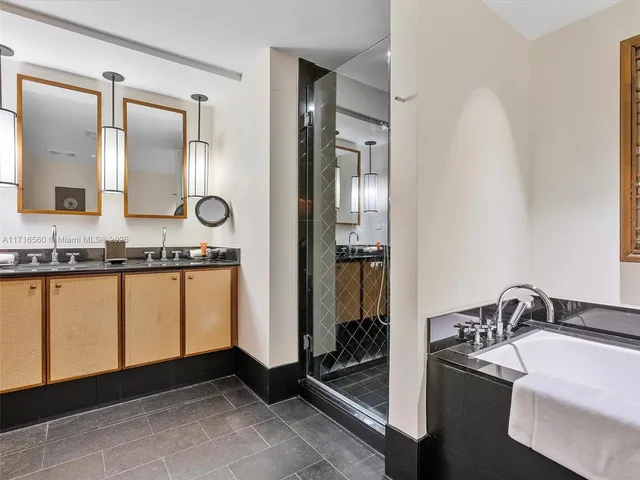 a bathroom with a sink and mirror