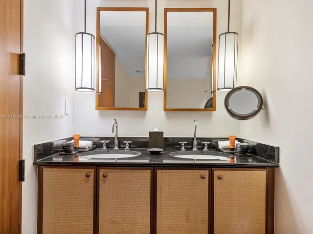 a kitchen with stainless steel appliances granite countertop a sink and a cabinets