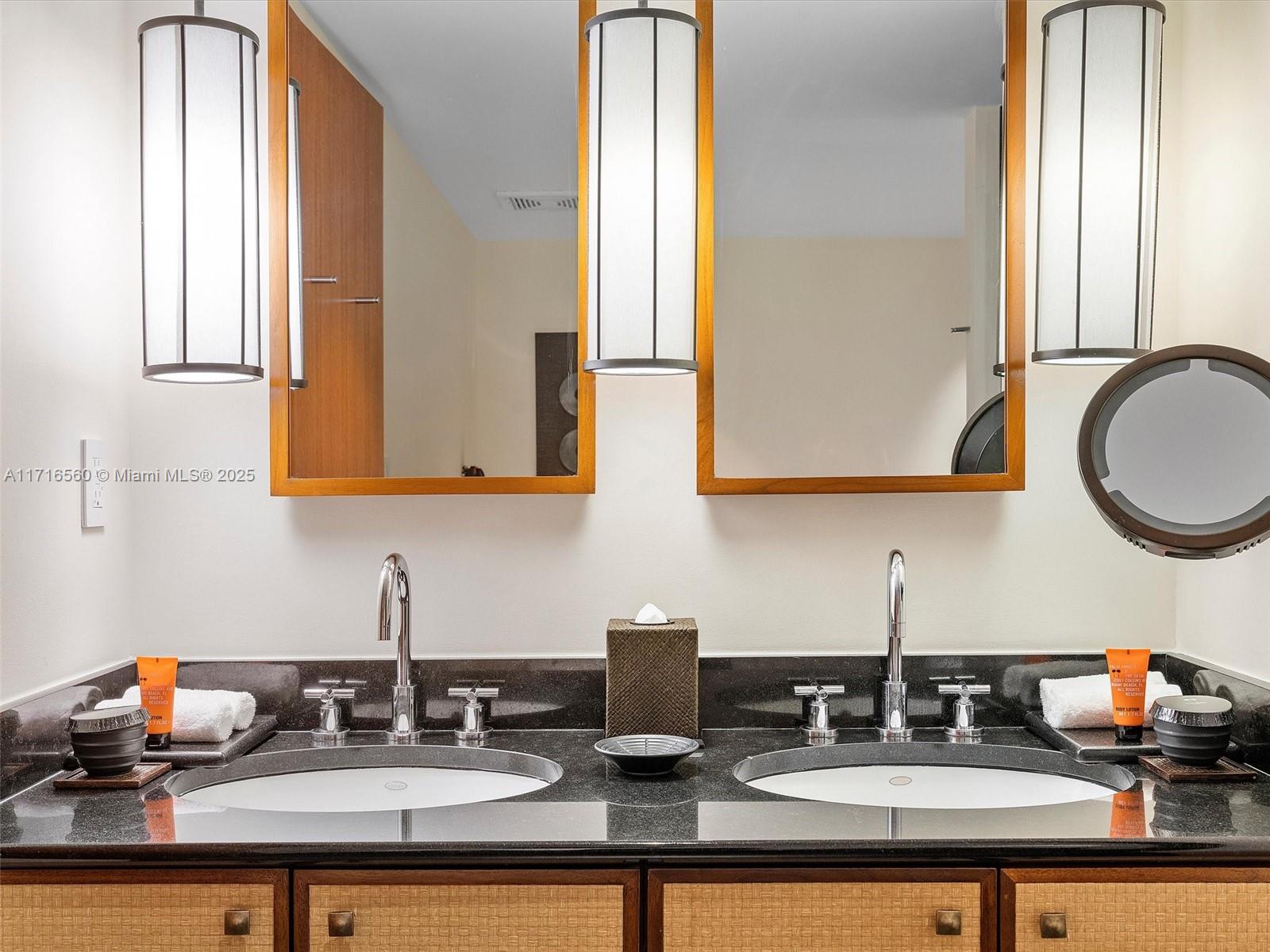 101 20th Street, Unit 3302 Miami Beach, FL 33139 - Photo 33 of 48 a bathroom with a sink and a mirror