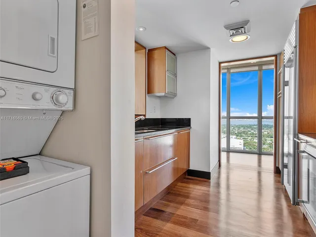 a view of storage and utility room with washer and dryer