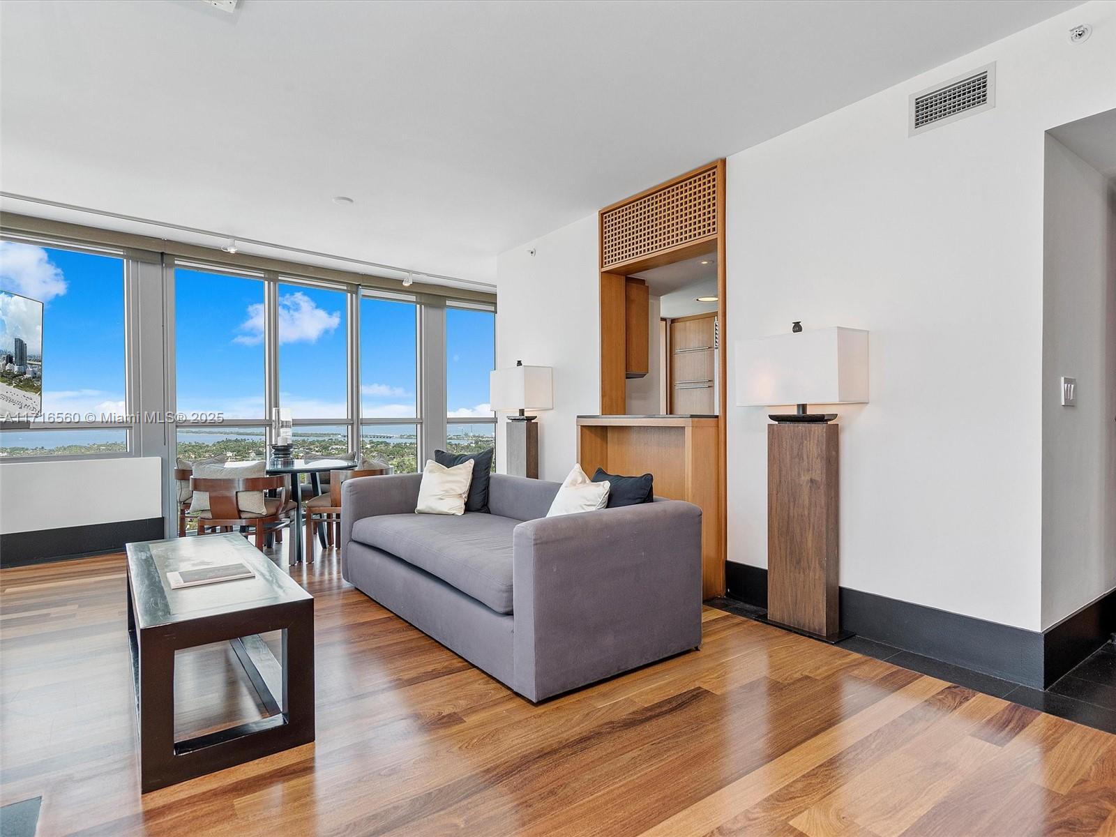 101 20th Street, Unit 3302 Miami Beach, FL 33139 - Photo 8 of 48 a living room with furniture and a large window