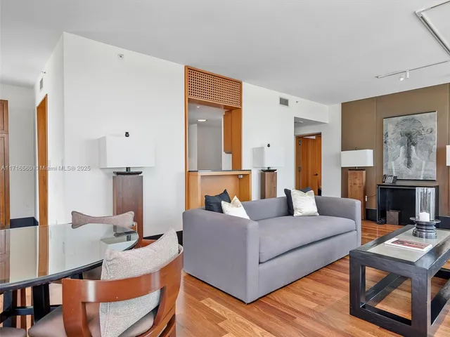 a living room with fireplace furniture and a table