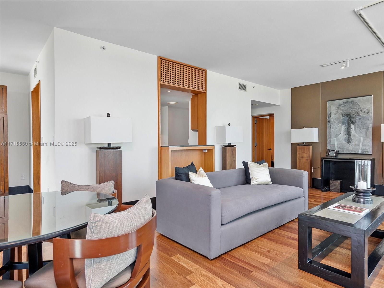 101 20th Street, Unit 3302 Miami Beach, FL 33139 - Photo 9 of 48 a living room with fireplace furniture and a table