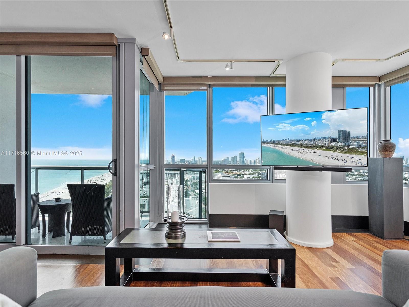101 20th Street, Unit 3302 Miami Beach, FL 33139 - Photo 10 of 48 a living room with stainless steel appliances kitchen island granite countertop furniture and a large window