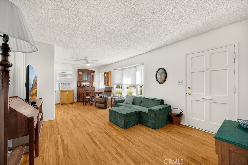 4577 Ranger Avenue El Monte, CA 91731 - Photo 6 of 25 a living room with furniture and a flat screen tv