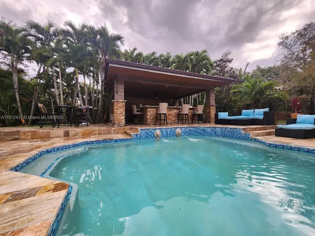 a view of a livingroom with furniture and window