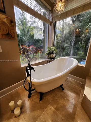 a kitchen with refrigerator and window