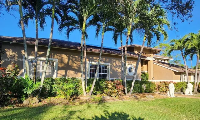 a view of a backyard of the house