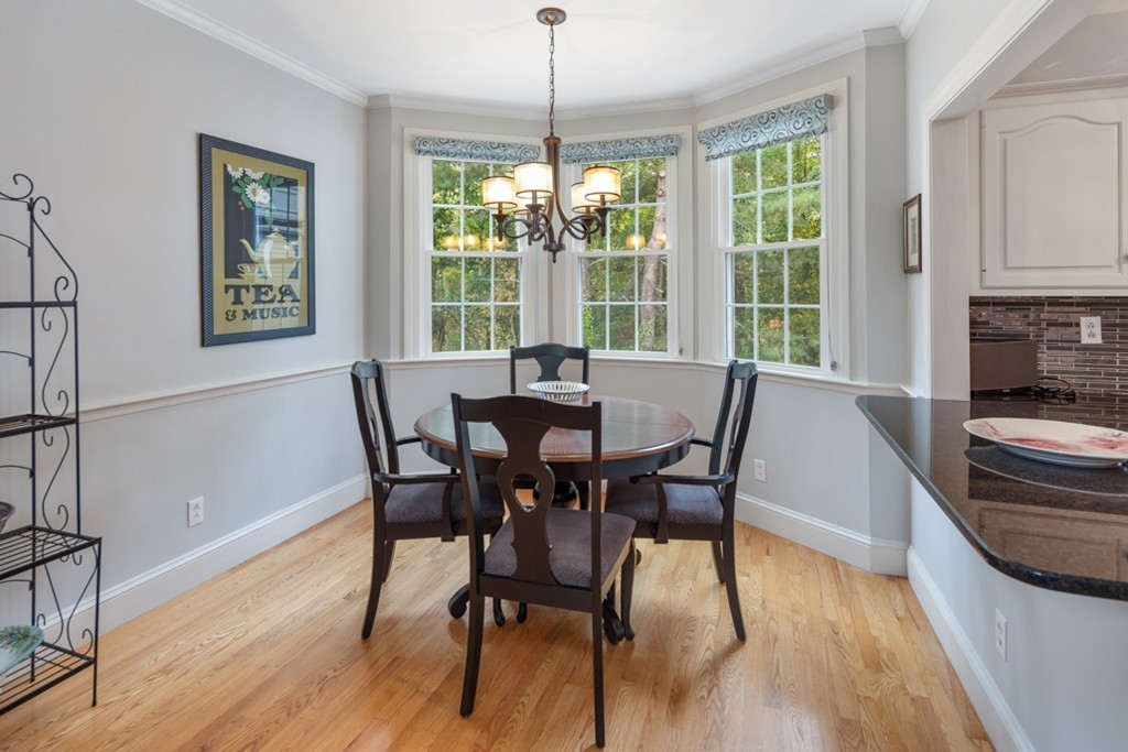 1193 Main Street, Unit D1 Hingham, MA 02043 - Photo 11 of 34 a view of a dining room with furniture window and wooden floor