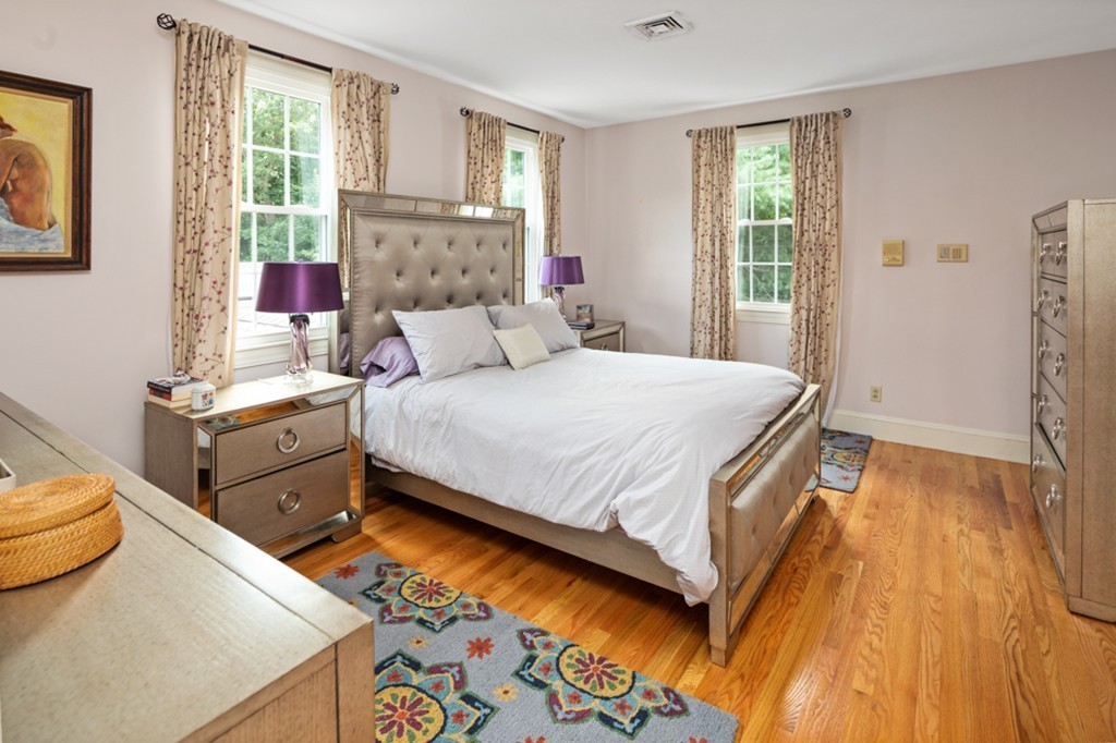 1193 Main Street, Unit D1 Hingham, MA 02043 - Photo 15 of 34 a bedroom with a bed and a window