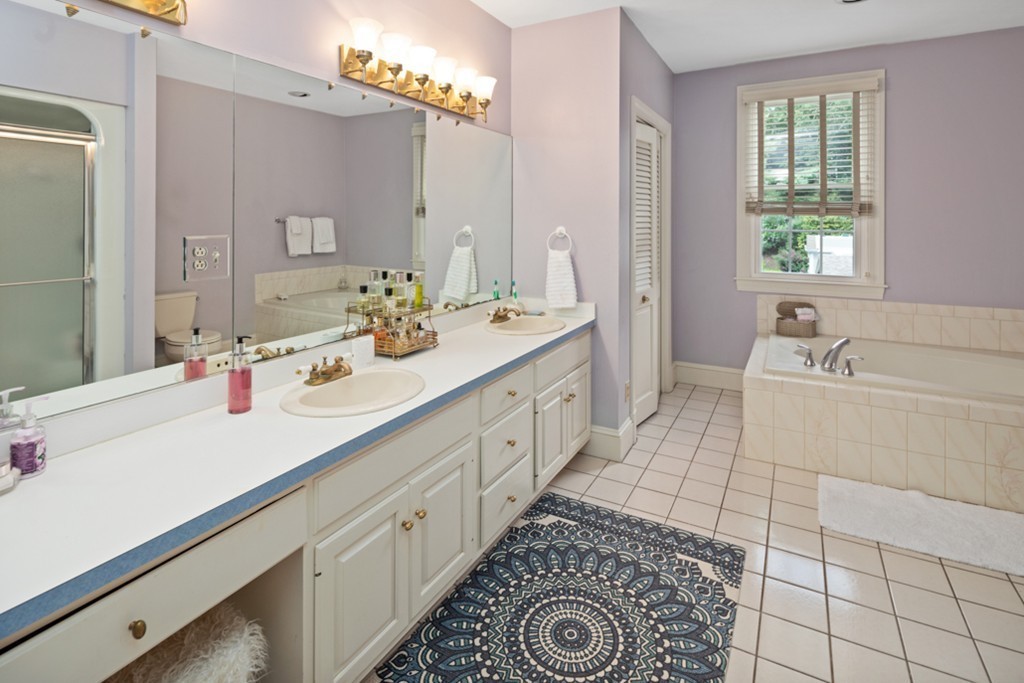 1193 Main Street, Unit D1 Hingham, MA 02043 - Photo 16 of 34 a spacious bathroom with a double vanity sink mirror and bathtub
