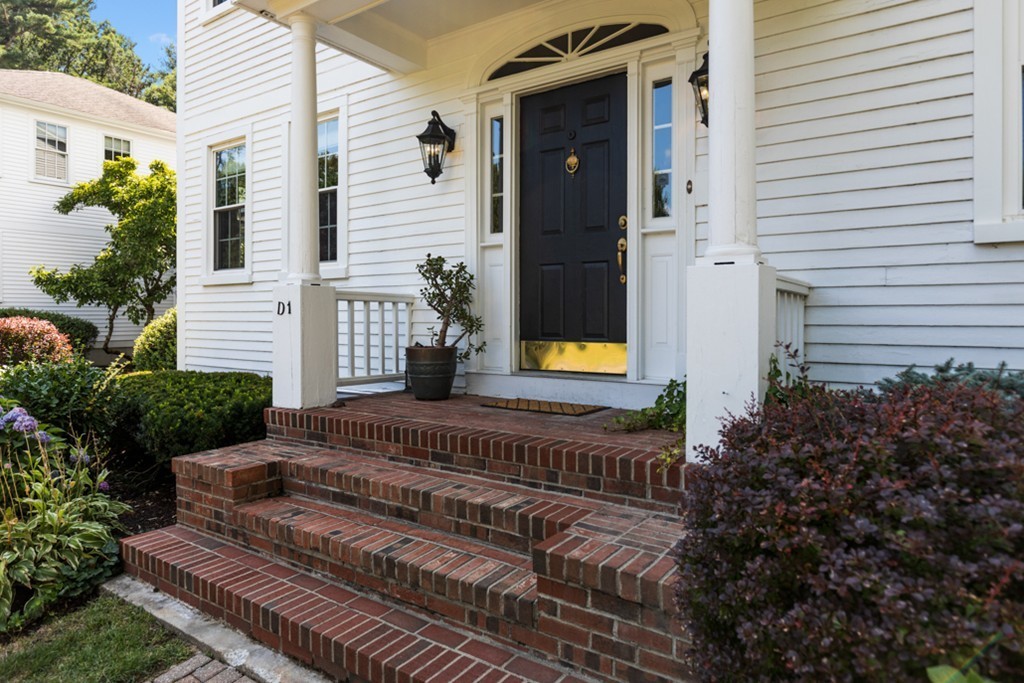 1193 Main Street, Unit D1 Hingham, MA 02043 - Photo 2 of 34 a view of a house with a patio