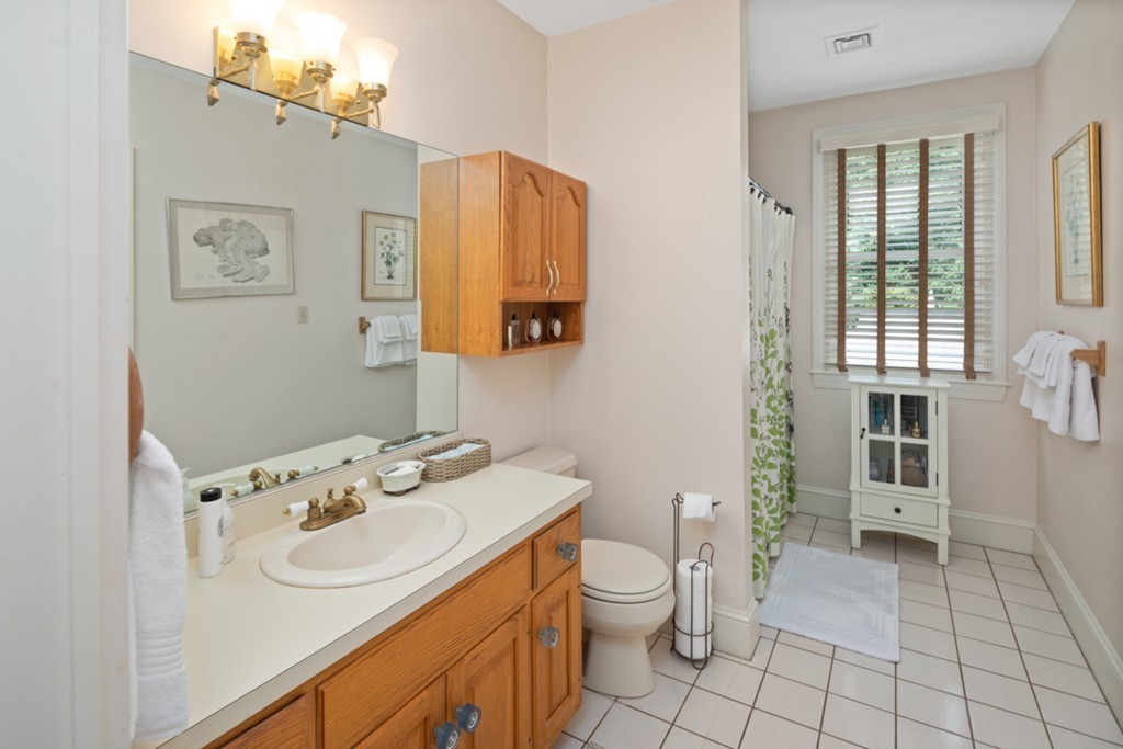 1193 Main Street, Unit D1 Hingham, MA 02043 - Photo 21 of 34 a bathroom with a sink toilet and shower