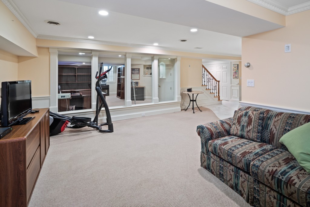 1193 Main Street, Unit D1 Hingham, MA 02043 - Photo 25 of 34 a living room with furniture gym equipment and a view of living room
