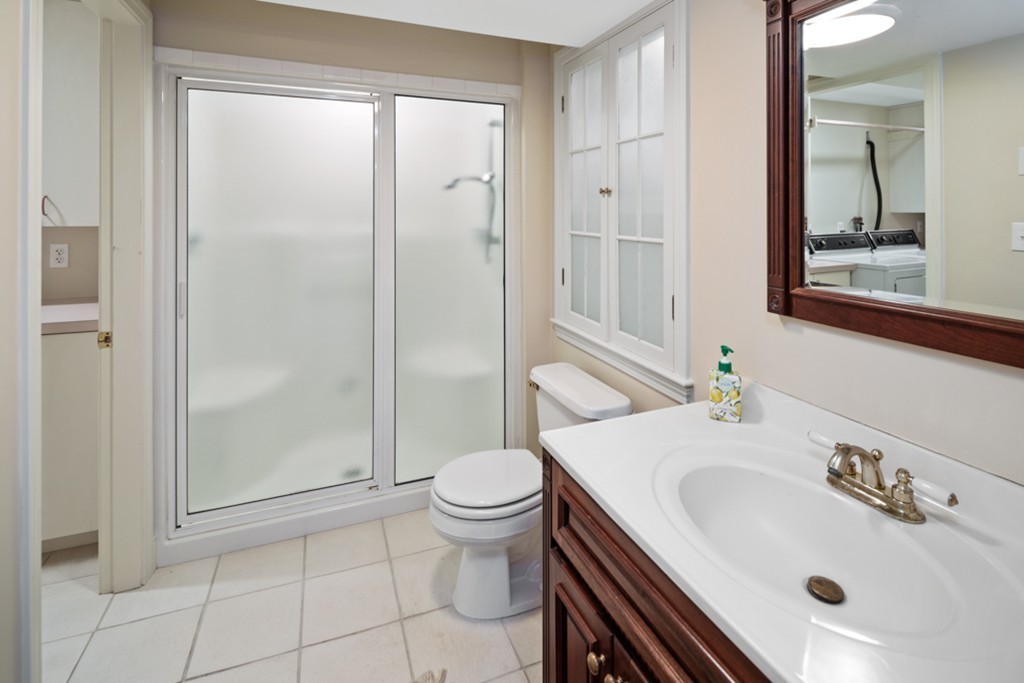 1193 Main Street, Unit D1 Hingham, MA 02043 - Photo 29 of 34 a bathroom with a sink toilet and shower