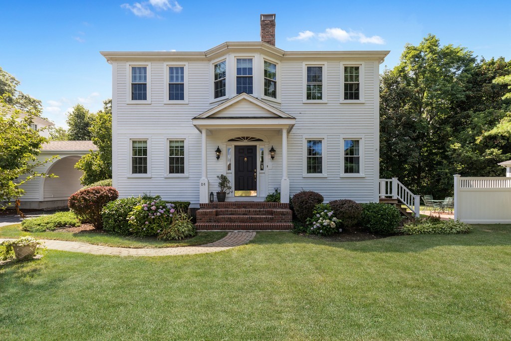 1193 Main Street, Unit D1 Hingham, MA 02043 - Photo 30 of 34 a front view of a house with a garden