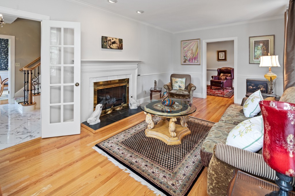 1193 Main Street, Unit D1 Hingham, MA 02043 - Photo 3 of 34 a living room with furniture and a fireplace