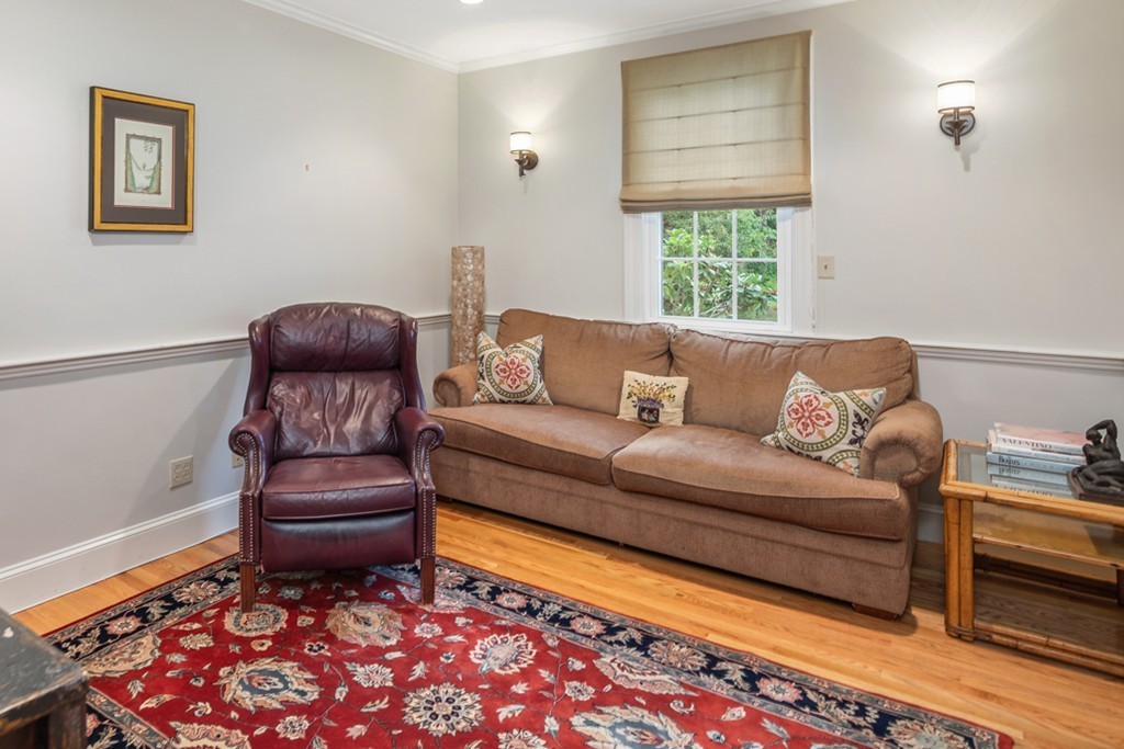 1193 Main Street, Unit D1 Hingham, MA 02043 - Photo 5 of 34 a living room with furniture and a rug