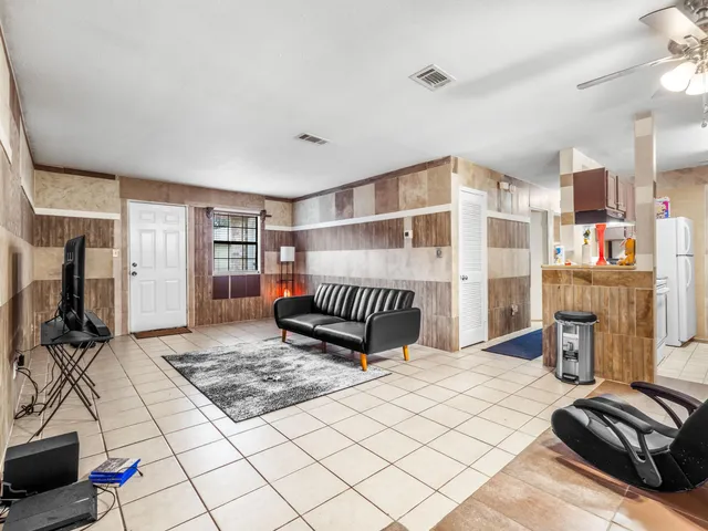 a bedroom with furniture and window