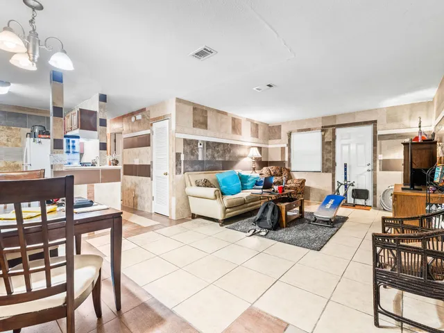 a living room with furniture and a table