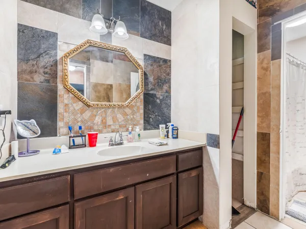 a bathroom with a sink and a mirror