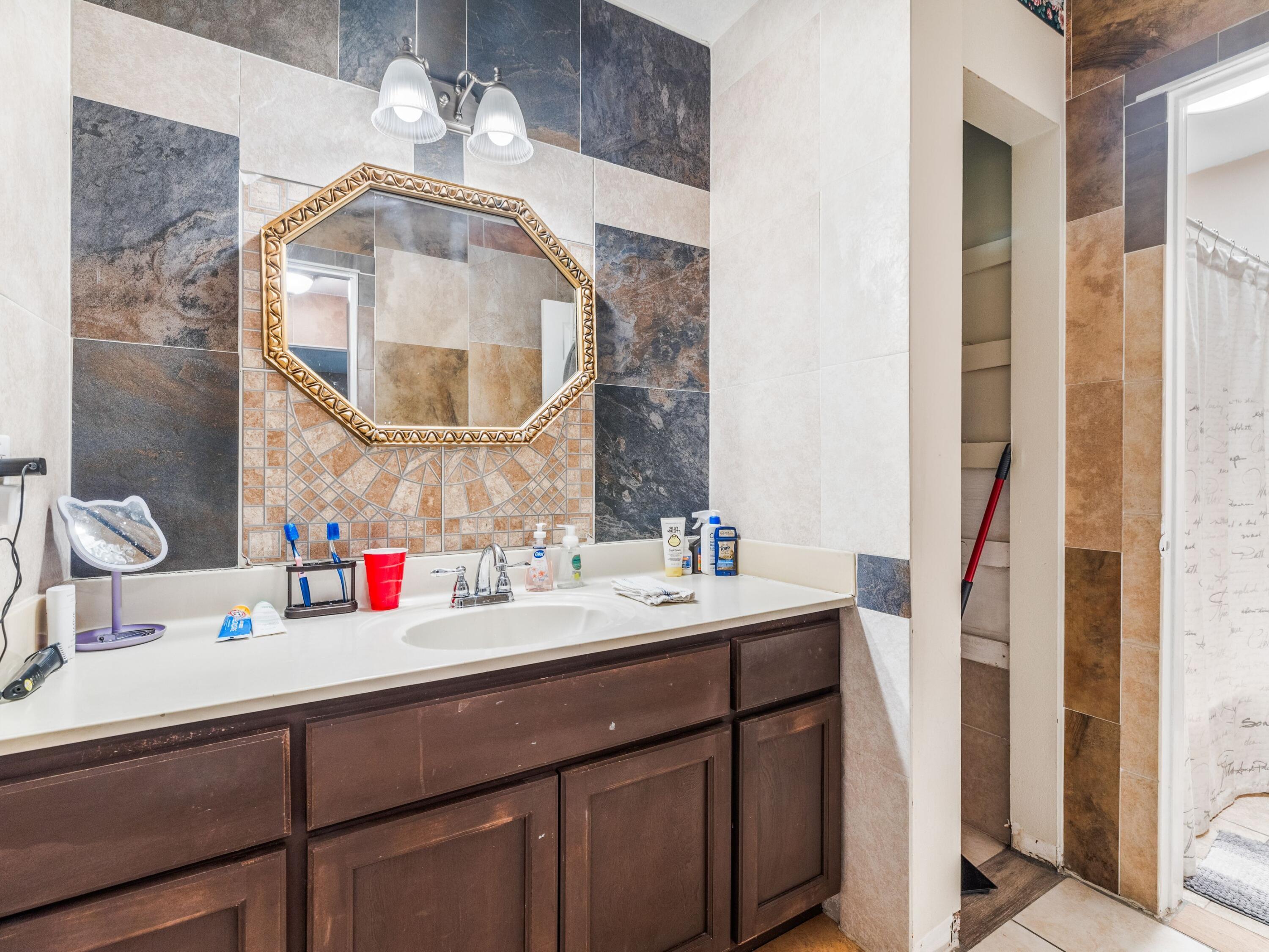 130 East 9 Mile Road, Unit 58 Pensacola, FL 32534 - Photo 46 of 50 a bathroom with a sink and a mirror